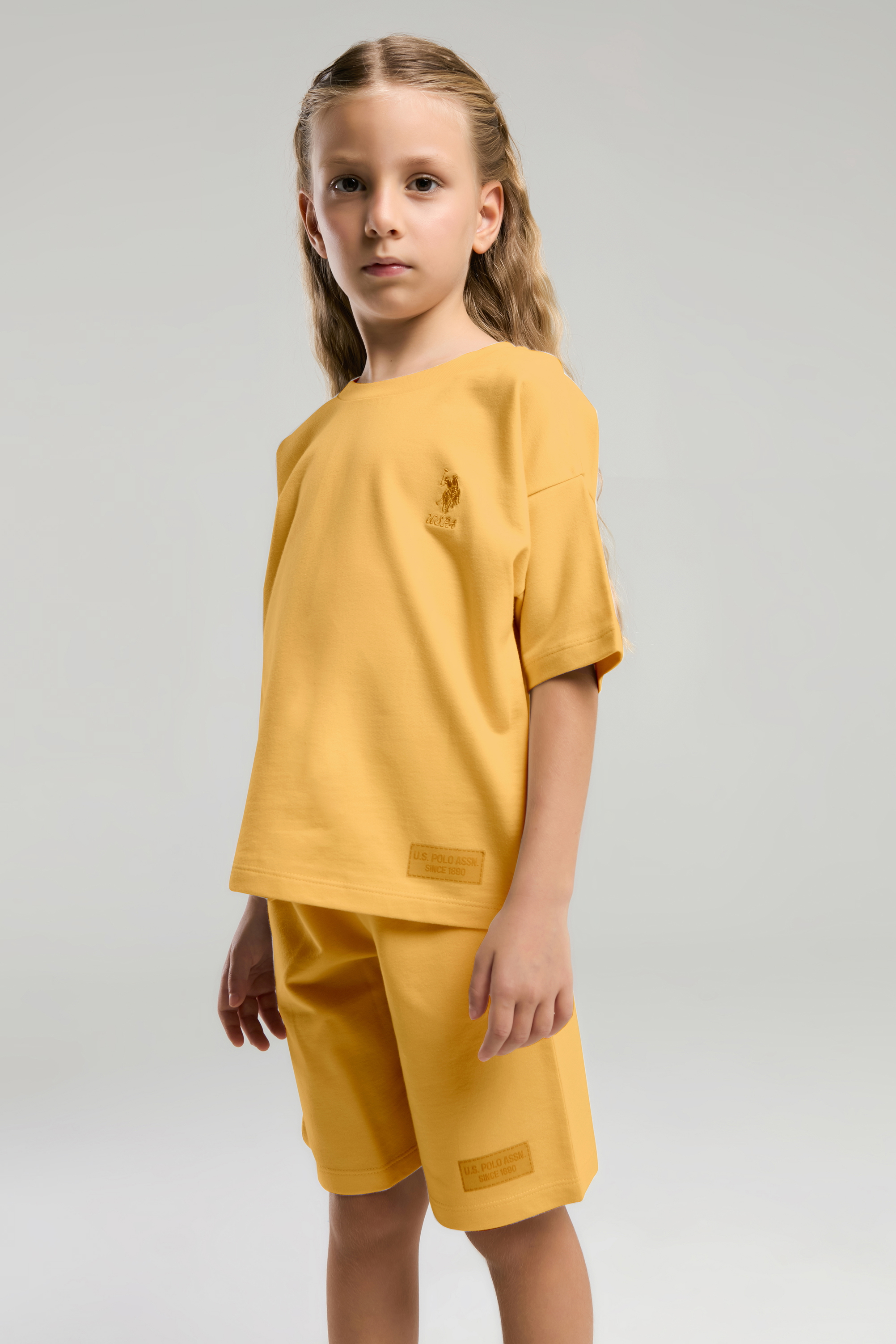 ست تی شرت و شلوارک زرد استاندارد فیت دخترانه یو اس پولو | US POLO ASSN